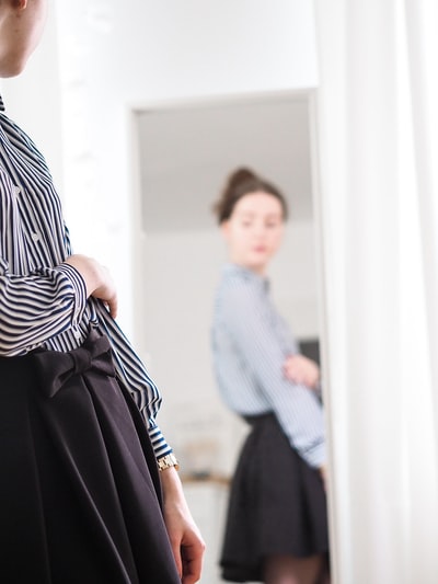 The woman in black and white stripes long-sleeved dress
